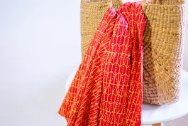 Pod batik fabric – orange on red