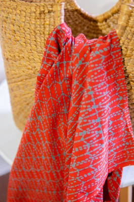 Pod batik fabric – green on red