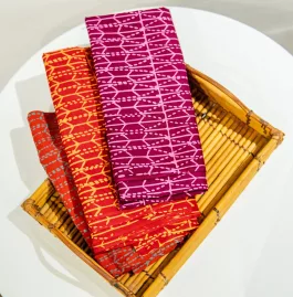 Pod batik fabric – pink on maroon